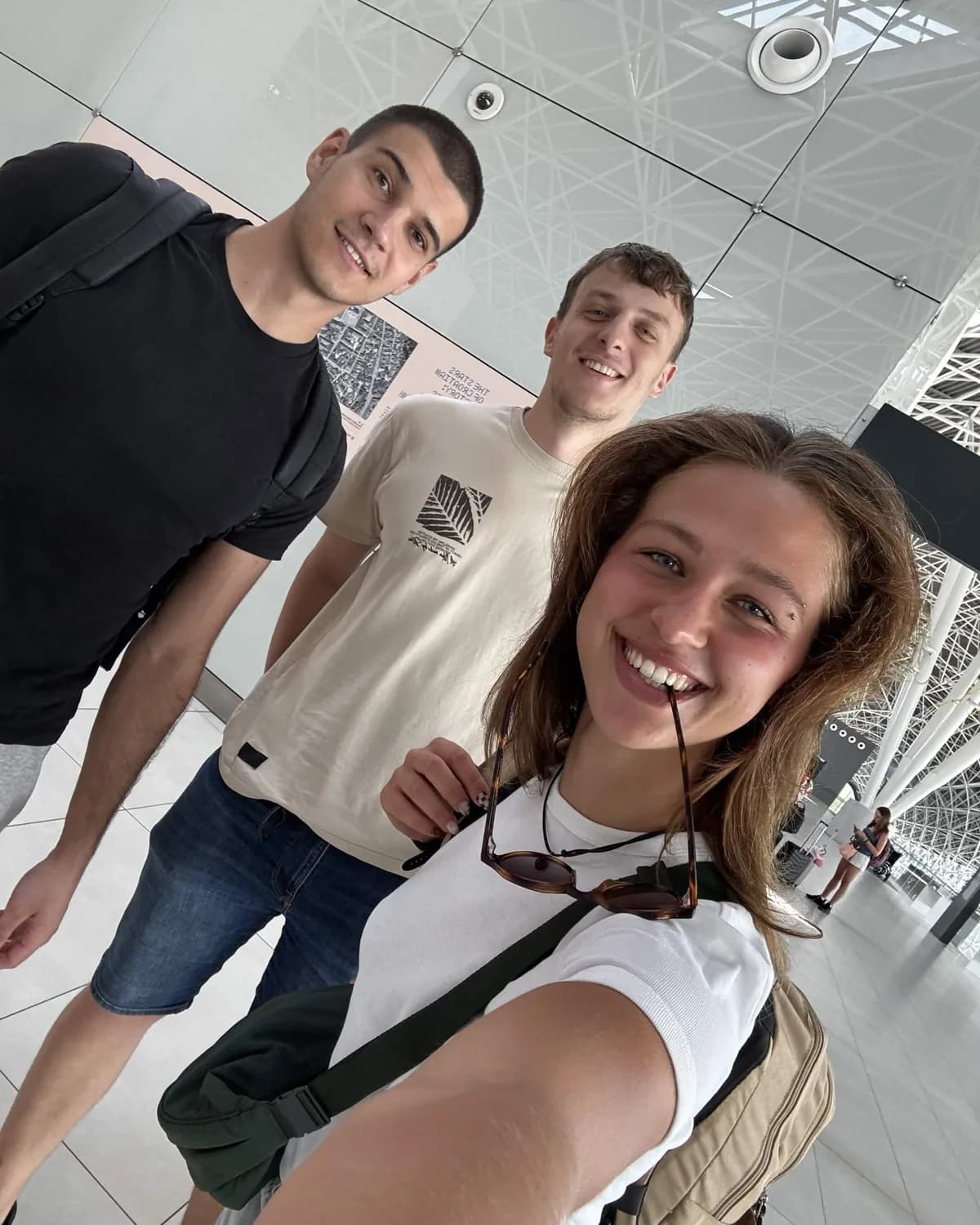 Three of the AskWhisper team at an airport, mid-trip